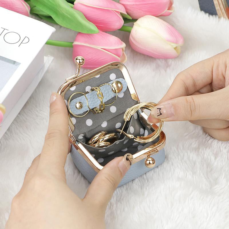 Open blue mini leather jewelry organizer with polka dot lining
