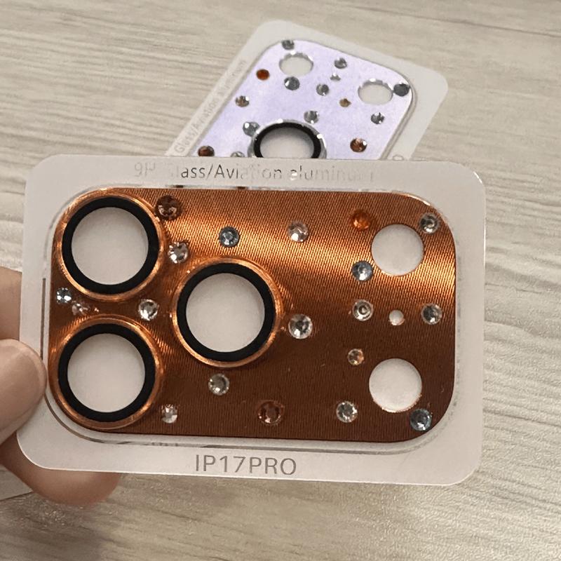 Orange CD-pattern diamond camera lens protector with visible fine surface texture