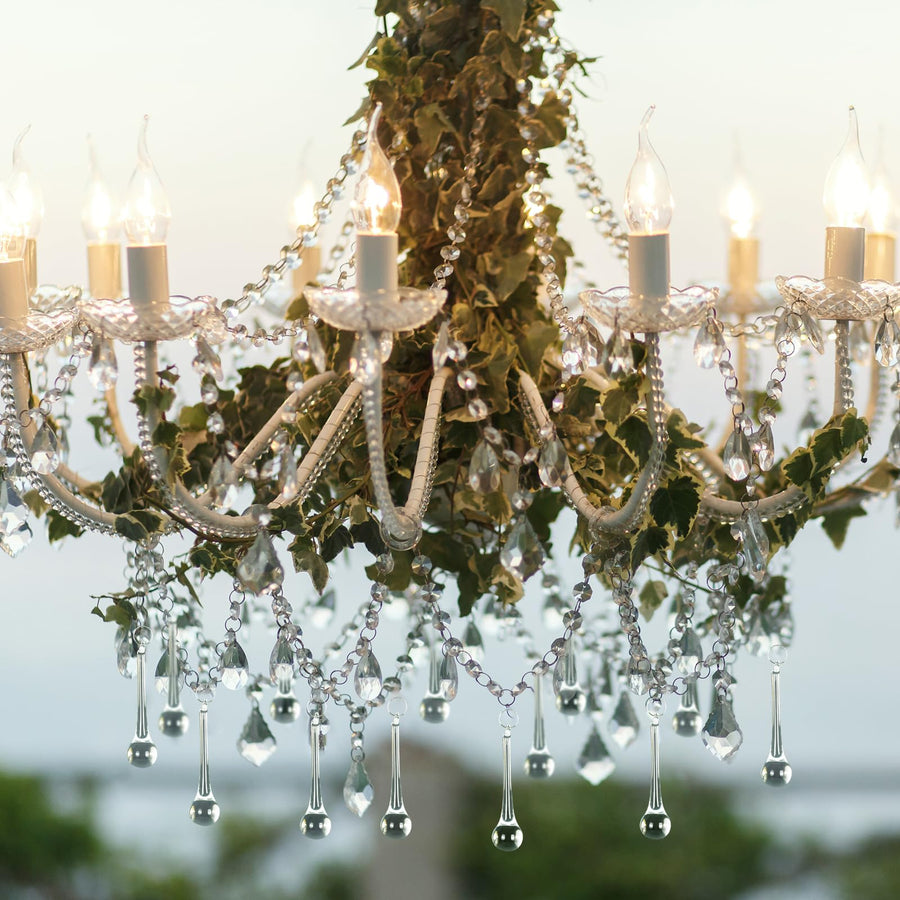 Decorative chandelier accented with clear hanging teardrop ornaments