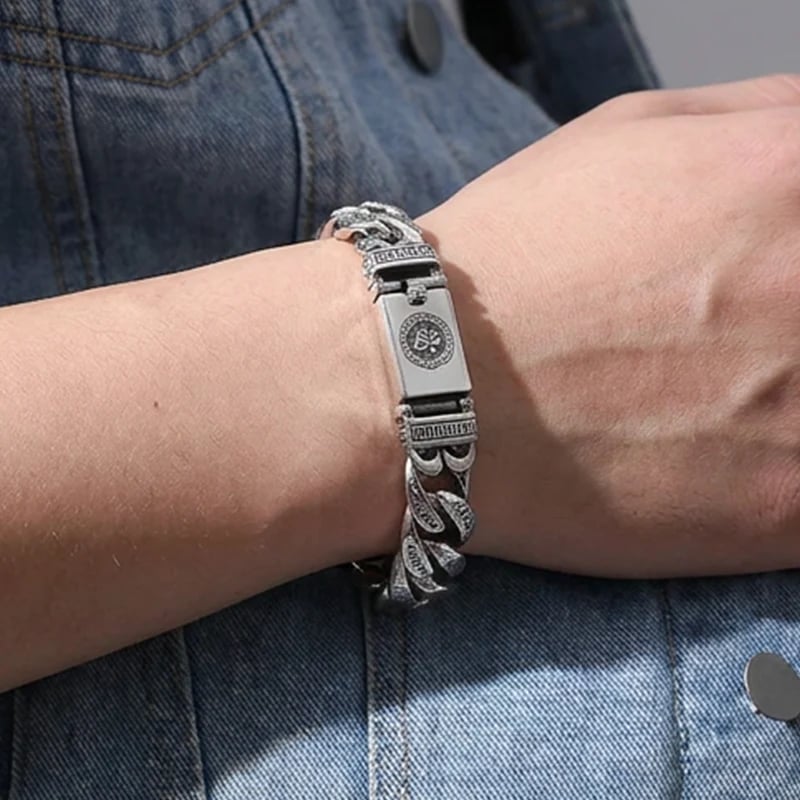 Retro silver mantra bracelet styled with denim