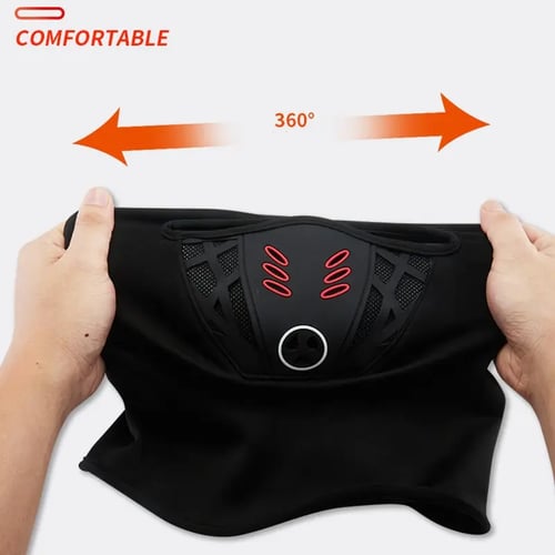 Hands stretching the winter balaclava sideways to demonstrate flexible fabric and fitted face panel