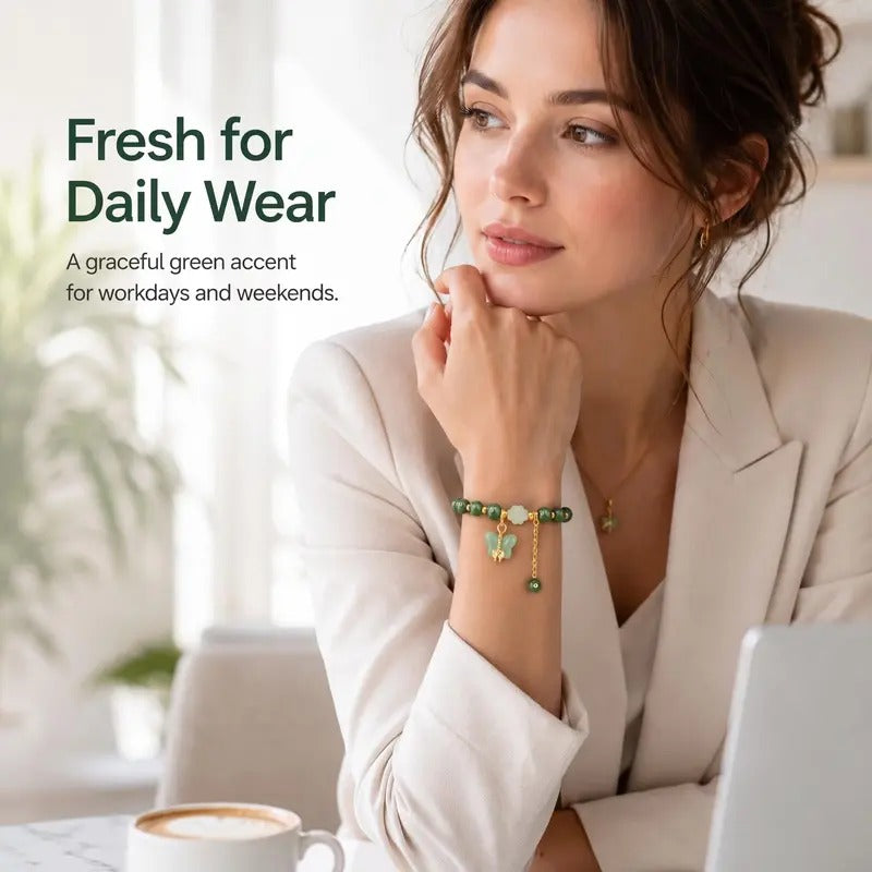 Green charm bracelet worn with a light blazer for daily wear