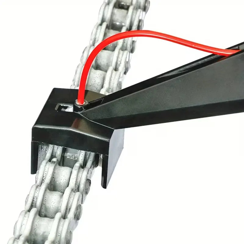 Close-up of motorcycle chain oiler head